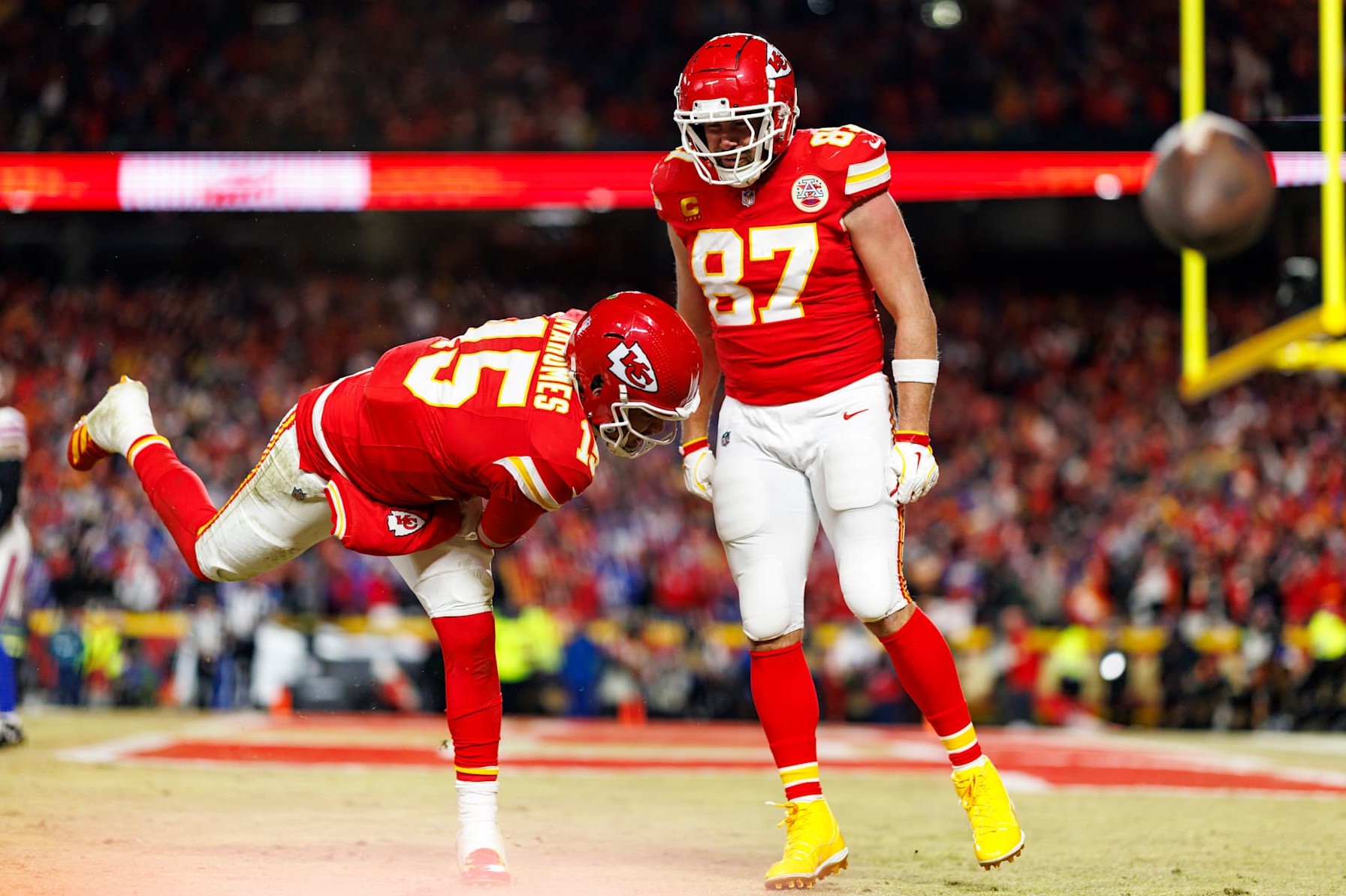 KANSAS CITY, MISSOURI - JANUARY 26: Quarterback Patrick Mahomes #15 of the Kansas City Chiefs celebrates with tight end Travis Kelce #87 after a touchdown during the second half of the AFC Championship football game against the Buffalo Bills, at GEHA Field at Arrowhead Stadium on January 26, 2025 in Kansas City, Missouri. (Photo by Brooke Sutton/Getty Images)