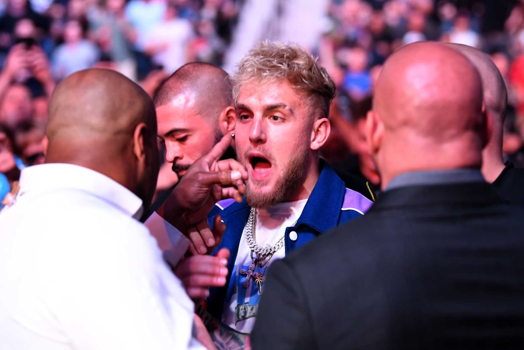 JACKSONVILLE, FLORIDA - APRIL 24: (L-R) Daniel Cormier interacts with Jake Paul during the UFC 261 event at VyStar Veterans Memorial Arena on April 24, 2021 in Jacksonville, Florida. (Photo by Josh Hedges/Zuffa LLC)