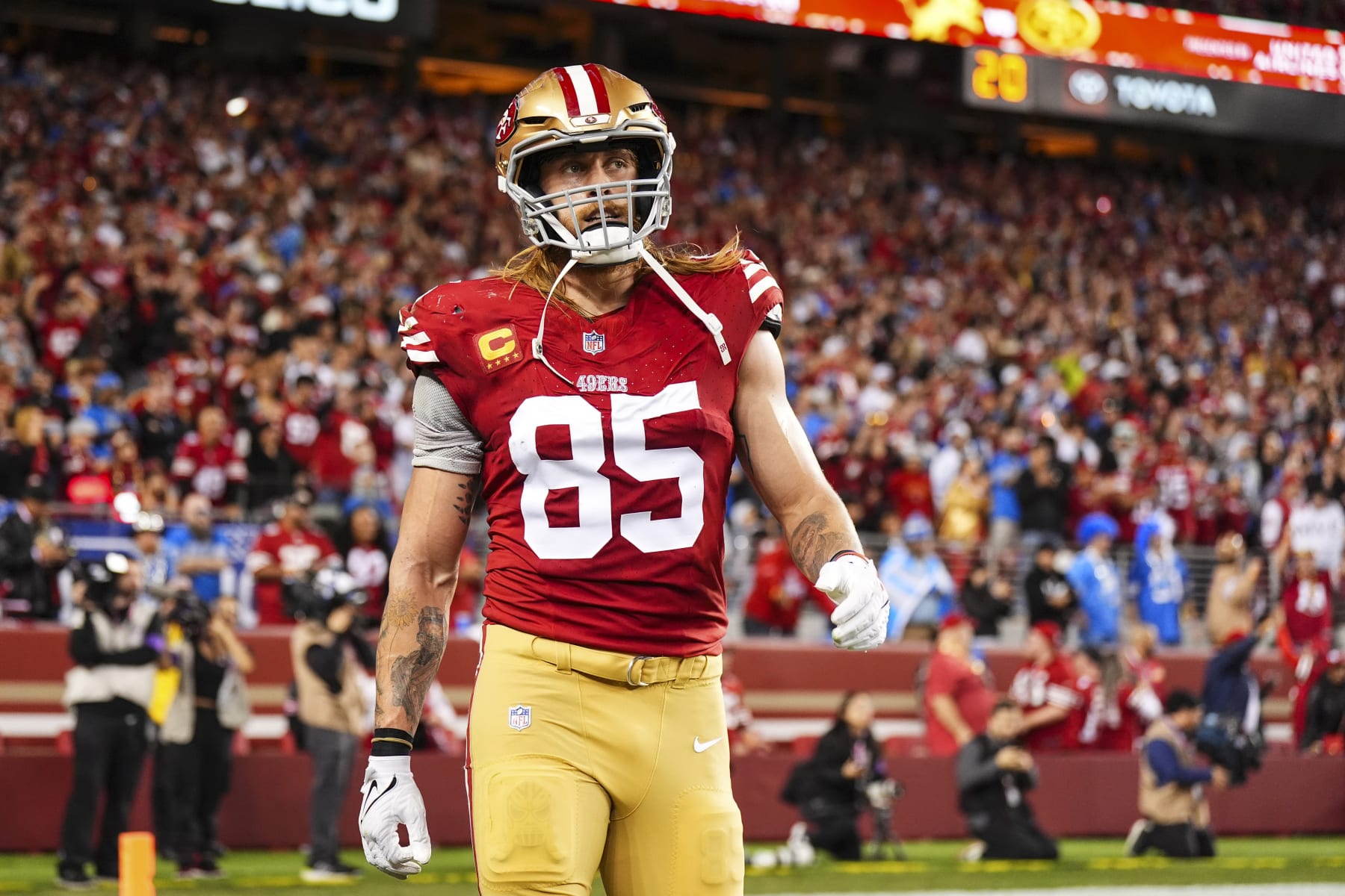 SANTA CLARA, CA - JANUARY 28: George Kittle #85 of the San Francisco 49ers looks on from the field during the NFC Championship NFL football game against the Detroit Lions at Levi's Stadium on January 28, 2024 in Santa Clara, California. (Photo by Cooper Neill/Getty Images)