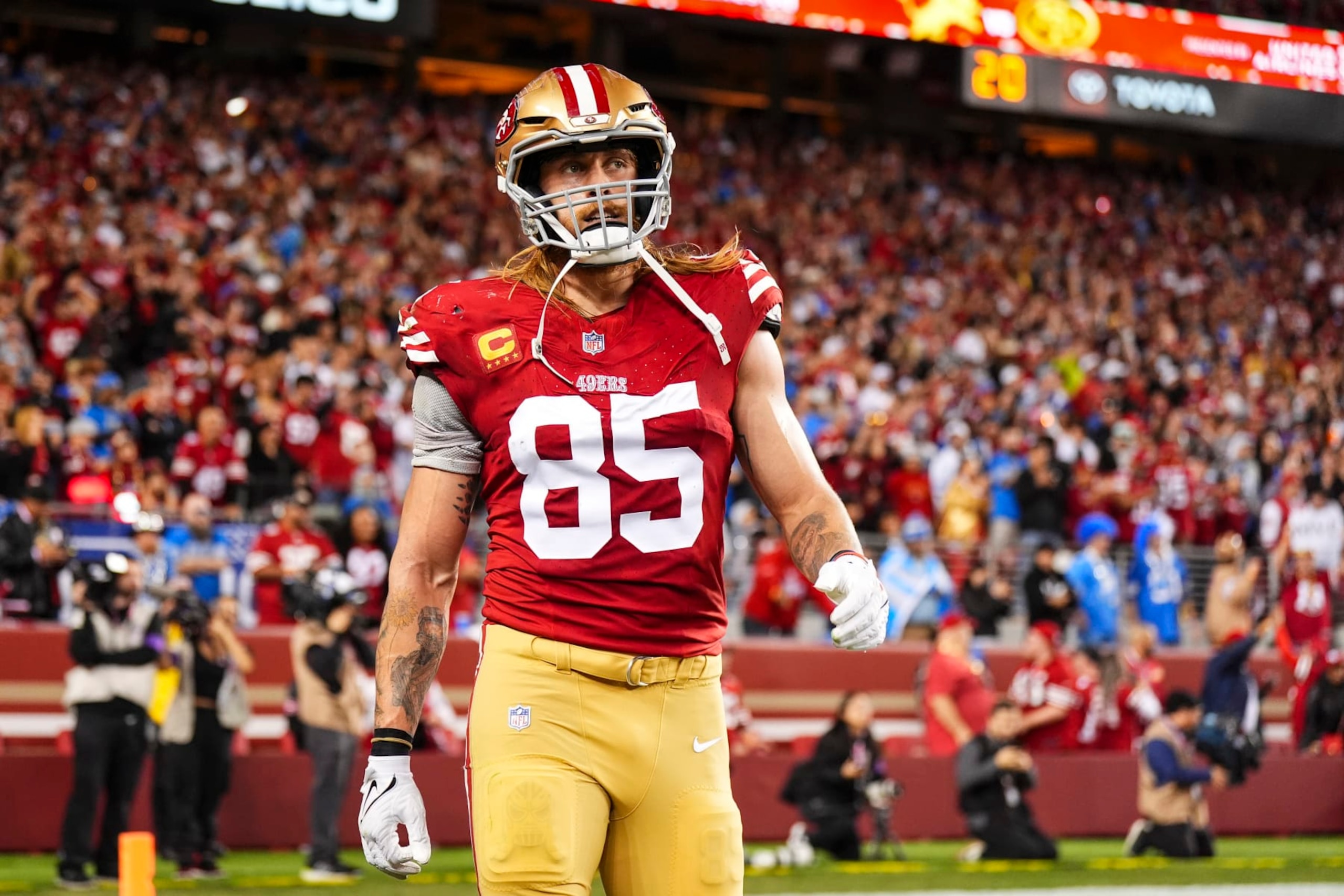SANTA CLARA, CA - JANUARY 28: George Kittle #85 of the San Francisco 49ers looks on from the field during the NFC Championship NFL football game against the Detroit Lions at Levi's Stadium on January 28, 2024 in Santa Clara, California. (Photo by Cooper Neill/Getty Images)