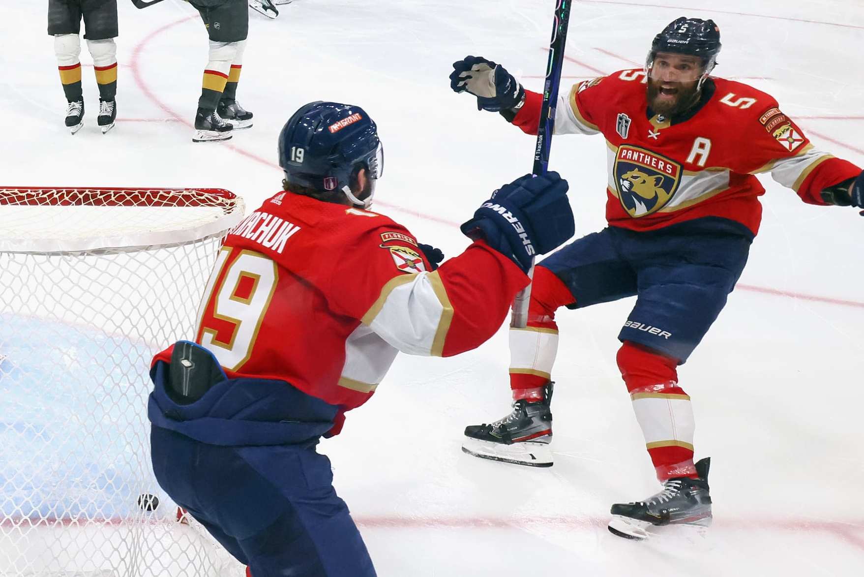 Matthew Tkachuk and Aaron Ekblad celebrate the Panthers' game-winning goal Thursday night.