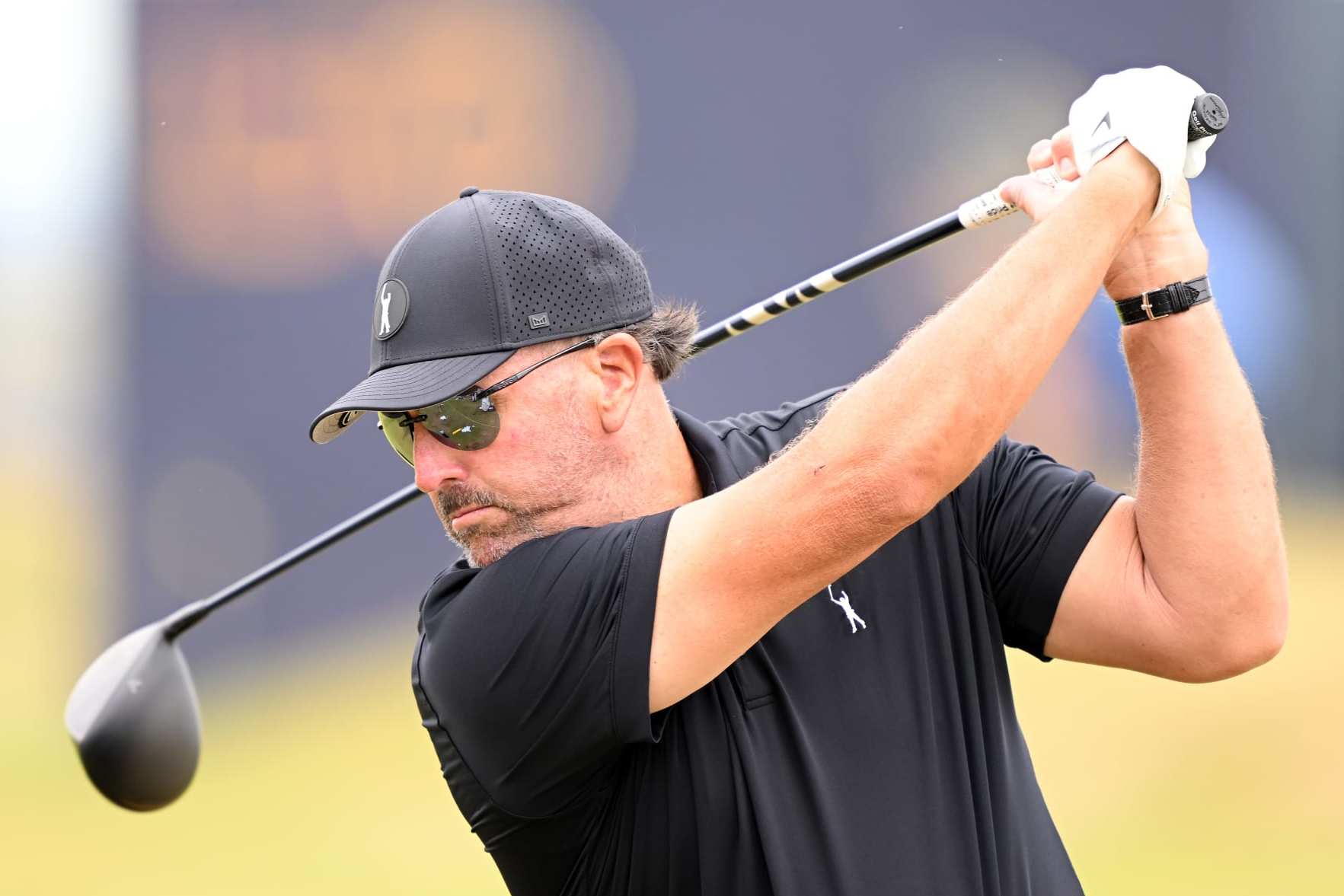 ST ANDREWS, SCOTLAND - JULY 12: Phil Mickleson of The United States tees off the driving range during a practice round prior to The 150th Open at St Andrews Old Course on July 12, 2022 in St Andrews, Scotland. (Photo by Ross Kinnaird/Getty Images)