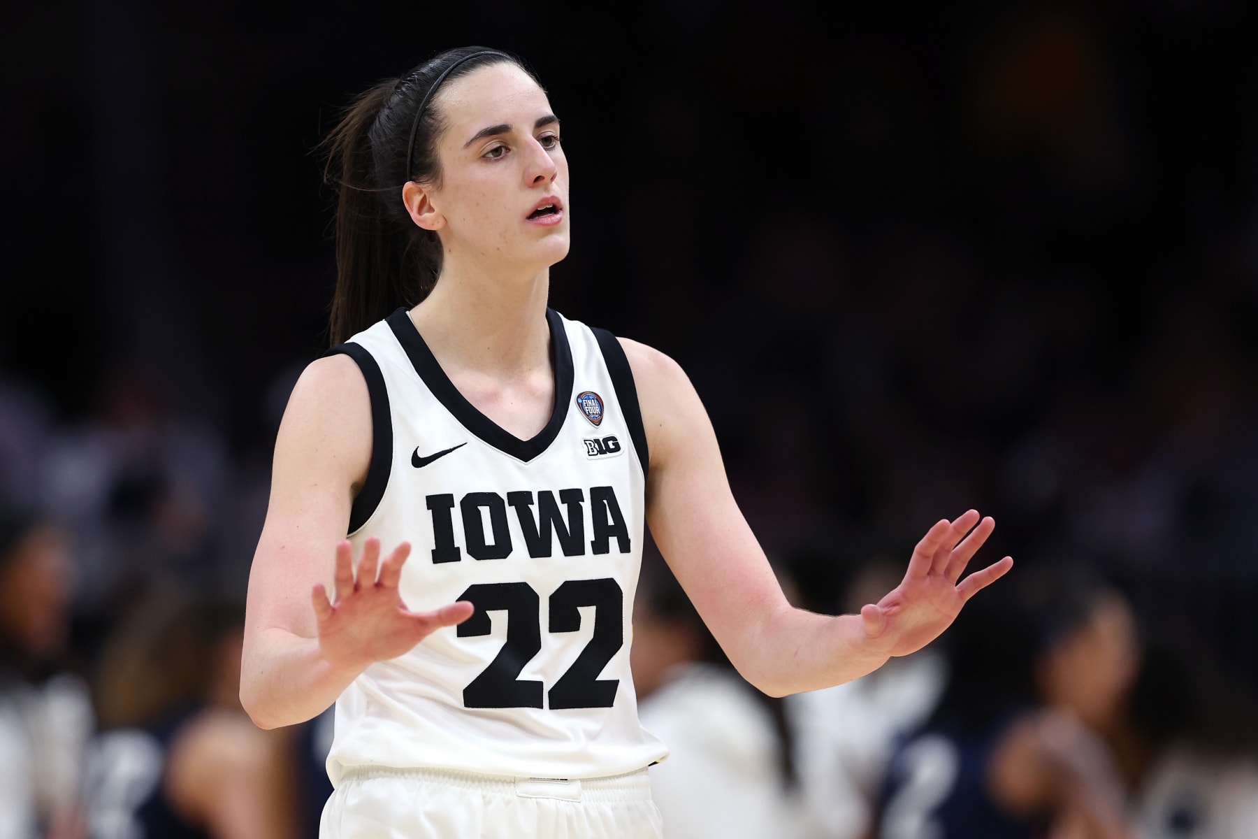 CLEVELAND, OHIO - APRIL 05: Caitlin Clark #22 of the Iowa Hawkeyes reacts in the second half during the NCAA Women's Basketball Tournament Final Four semifinal game against the UConn Huskies at Rocket Mortgage Fieldhouse on April 05, 2024 in Cleveland, Ohio. (Photo by Steph Chambers/Getty Images)