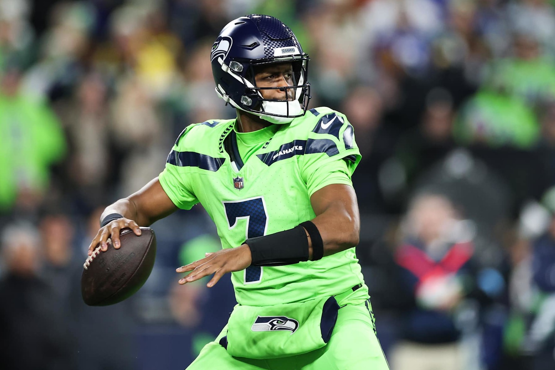 SEATTLE, WASHINGTON - DECEMBER 15: Geno Smith #7 of the Seattle Seahawks throws a pass against the Green Bay Packers during the first quarter at Lumen Field on December 15, 2024 in Seattle, Washington. (Photo by Steph Chambers/Getty Images)