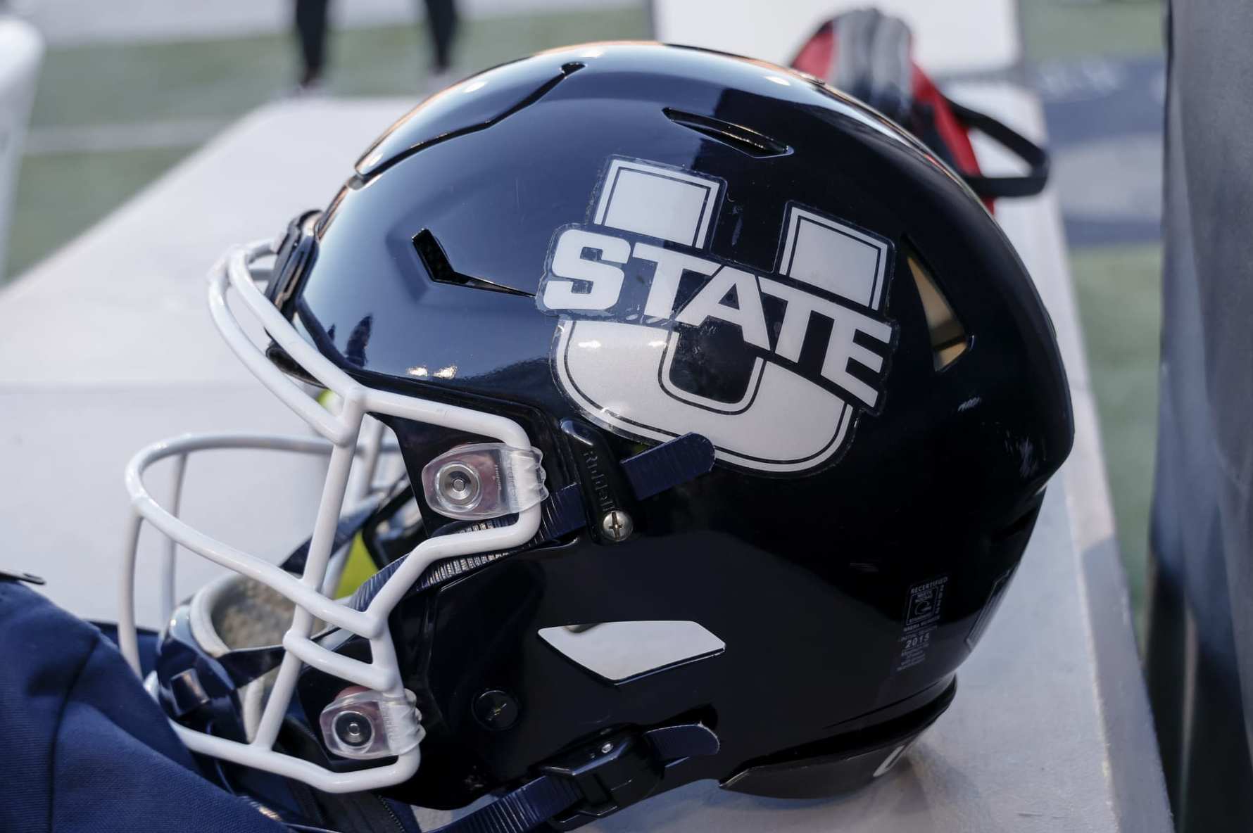 DALLAS, TX - DECEMBER 27: A Utah State Aggies helmet sits on the bench during the SERVPRO First Responder Bowl game between the Memphis Tigers and the Utah State Aggies on December 27, 2022 at Gerald J. Ford Stadium in Dallas, Texas. (Photo by Matthew Pearce/Icon Sportswire via Getty Images)
