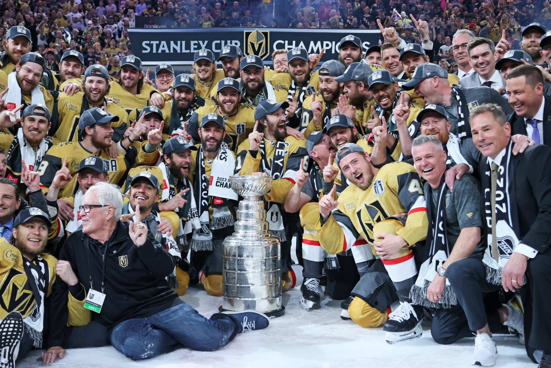 LAS VEGAS, NEVADA - JUNE 13: Members of the Vegas Golden Knights pose with the Stanley Cup after defeating the Florida Panthers to win the championship in Game Five of the 2023 NHL Stanley Cup Final at T-Mobile Arena on June 13, 2023 in Las Vegas, Nevada. (Photo by Bruce Bennett/Getty Images)