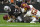 Washington Football Team's Daniel Wise (92), Deshazor Everett (22) and Jamin Davis (52) tackle Las Vegas Raiders running back Kenyan Drake (23) during the first half of an NFL football game, Sunday, Dec. 5, 2021, in Las Vegas. (AP Photo/David Becker)