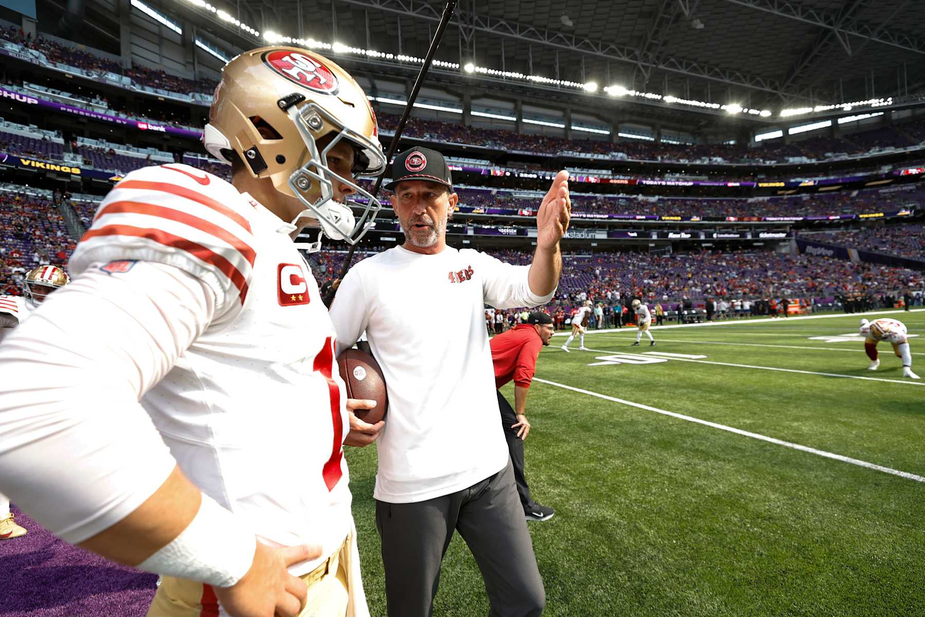 MINNEAPOLIS, MN - SEPTEMBER 15: Brock Purdy #13 and Head Coach Kyle Shanahan of the San Francisco 49ers before the game against the Minnesota Vikings at U.S. Bank Stadium on September 15, 2024 in Minneapolis, Minnesota. The Vikings defeated the 49ers 23-17. (Photo by Michael Zagaris/San Francisco 49ers/Getty Images)
