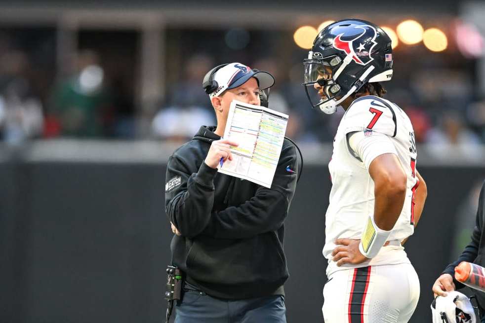ATLANTA, GA OCTOBER 08: Houston quarterback C.J. Stroud (7) talks with offensive coordinator Bobby Slowik during the NFL game between the Houston Texans and the Atlanta Falcons on October 8th, 2023 at Mercedes-Benz Stadium in Atlanta, GA. (Photo by Rich von Biberstein/Icon Sportswire via Getty Images)