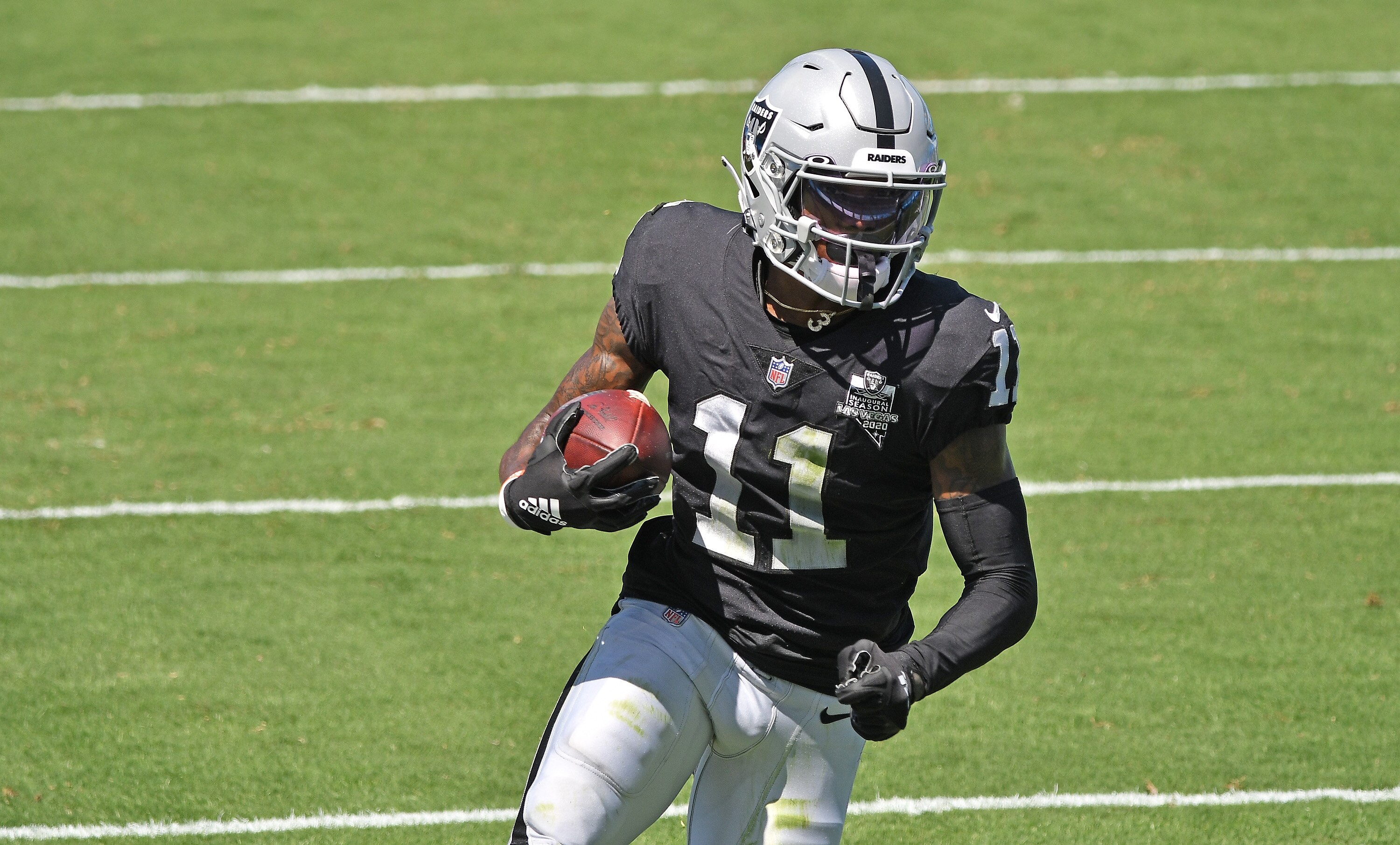 CHARLOTTE, NORTH CAROLINA - SEPTEMBER 13: Henry Ruggs III #11 of the Las Vegas Raiders runs after making a catch against the Carolina Panthers during their game at Bank of America Stadium on September 13, 2020 in Charlotte, North Carolina. Las Vegas won 34-30. (Photo by Grant Halverson/Getty Images)