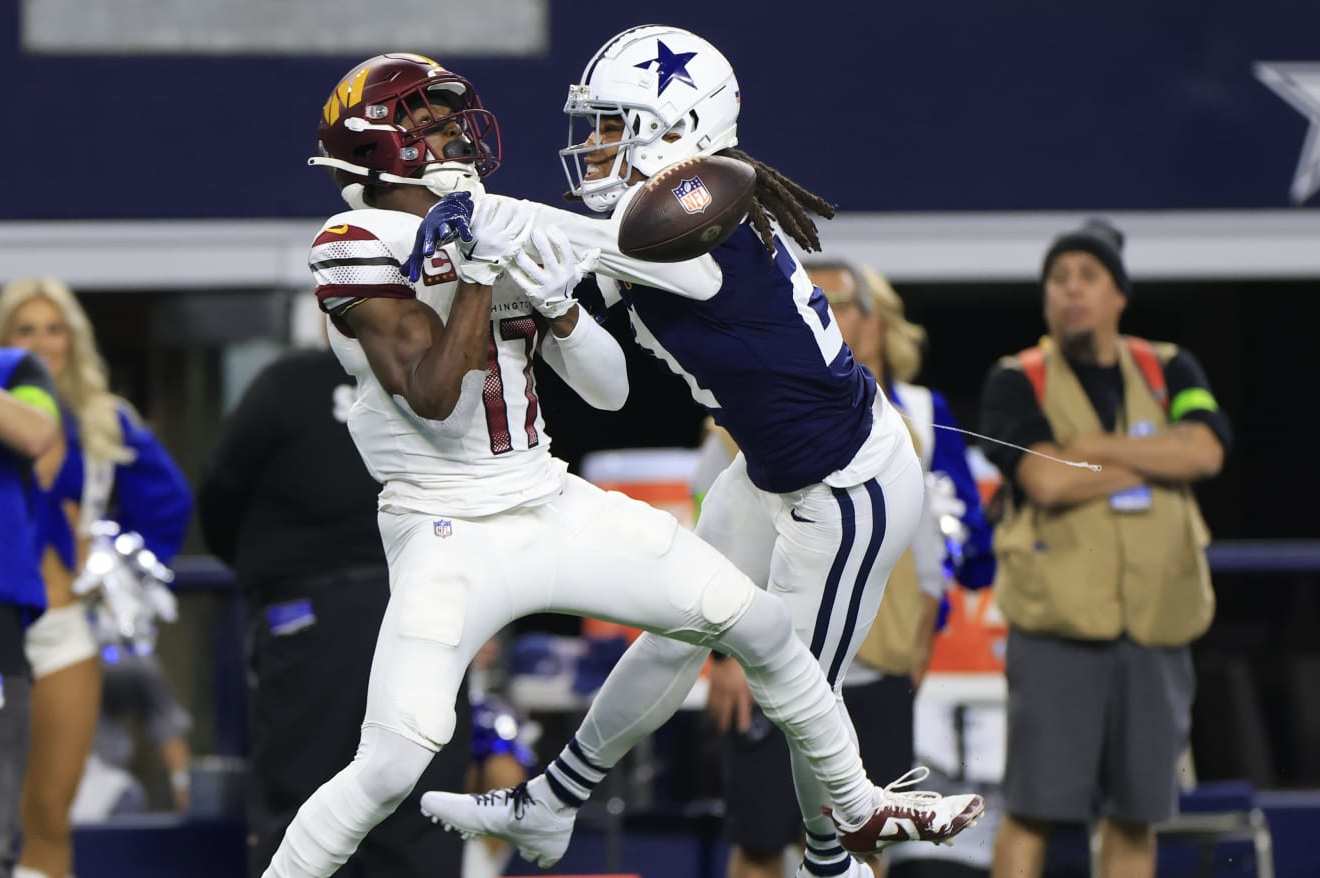 ARLINGTON, TEXAS - NOVEMBER 23: Stephon Gilmore #21 of the Dallas Cowboys breaks up a pass intended for Terry McLaurin #17 of the Washington Commanders during the third quarter at AT&T Stadium on November 23, 2023 in Arlington, Texas. (Photo by Ron Jenkins/Getty Images)