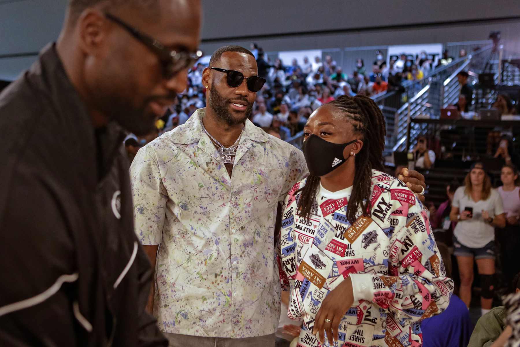 LOS ANGELES, CA - JUNE 30: LeBron James talks with  Nneka Ogwumike as Dwyane Wade passes by while attending a Los Angeles Sparks WNBA game on Wednesday, June 30, 2021 in Los Angeles, CA. (Jason Armond / Los Angeles Times via Getty Images)