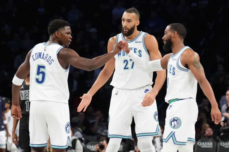 BROOKLYN, NY - JANUARY 25: The Anthony Edwards #5, Rudy Gobert #27 and Mike Conley #10 of the Minnesota Timberwolves celebrate during the game against the Brooklyn Nets on January 25, 2024 at Barclays Center in Brooklyn, New York. NOTE TO USER: User expressly acknowledges and agrees that, by downloading and or using this Photograph, user is consenting to the terms and conditions of the Getty Images License Agreement. Mandatory Copyright Notice: Copyright 2024 NBAE (Photo by Jesse D. Garrabrant/NBAE via Getty Images)