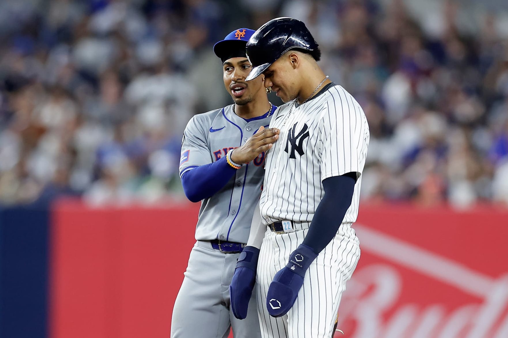 NEW YORK, NEW YORK - JULY 24: Juan Soto #22 of the New York Yankees stands at second base during the fifth inning with Francisco Lindor #12 of the New York Mets at Yankee Stadium on July 24, 2024 in New York City. (Photo by Jim McIsaac/Getty Images)