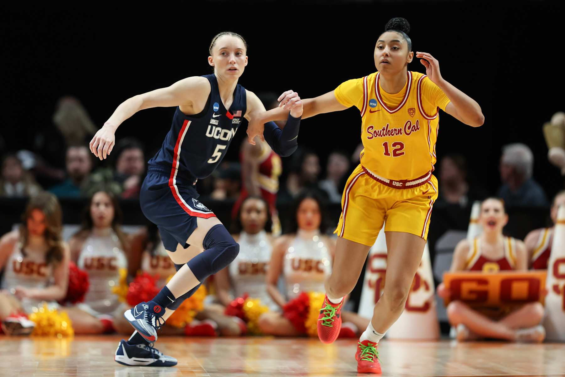 PORTLAND, OREGON - APRIL 01: Paige Bueckers #5 of the Connecticut Huskies defends JuJu Watkins #12 of the USC Trojans during the second half in the Elite 8 round of the NCAA Women's Basketball Tournament at Moda Center on April 01, 2024 in Portland, Oregon. (Photo by Steph Chambers/Getty Images)