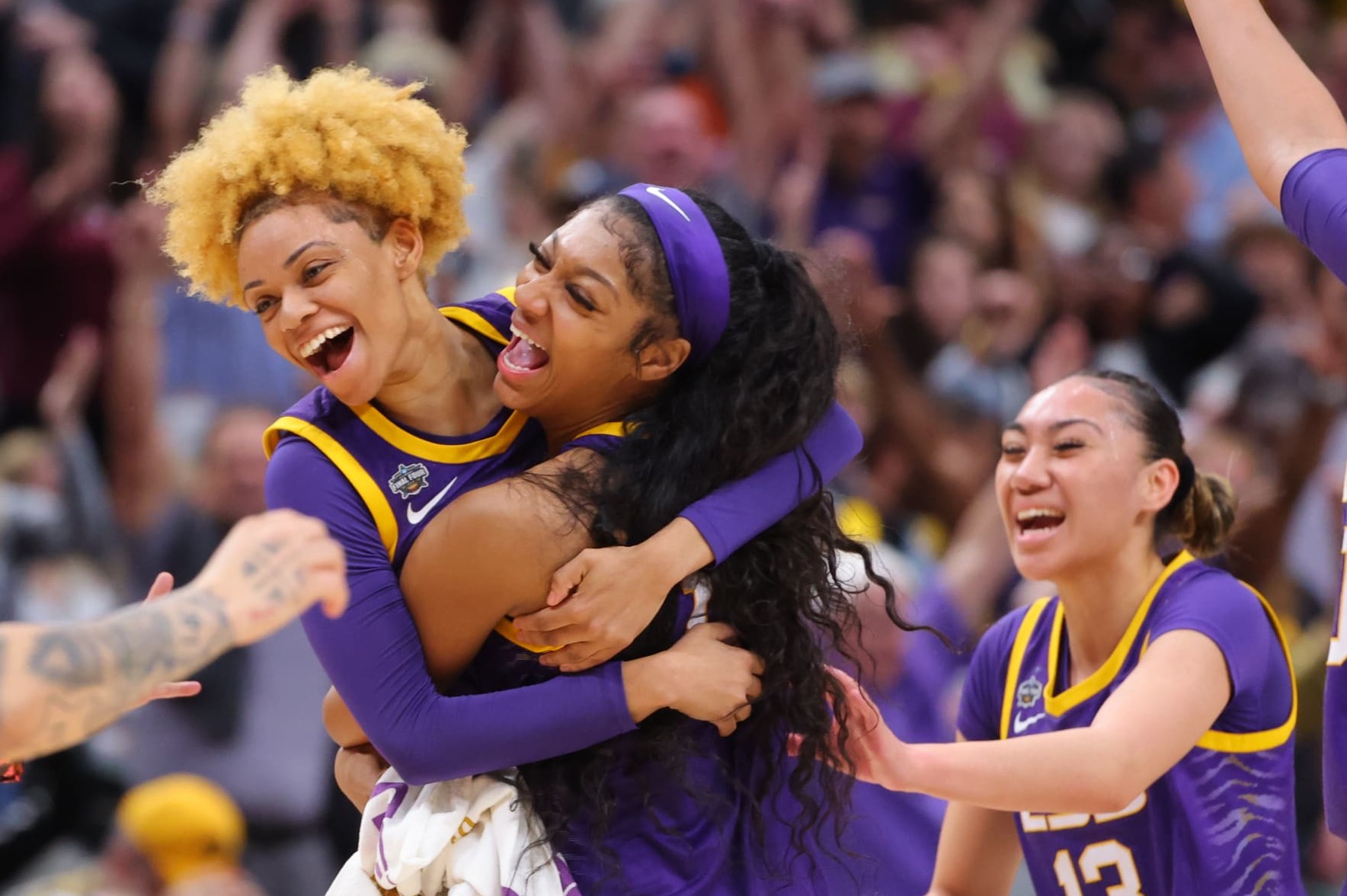 DALLAS, TX - APRIL 02: Jasmine Carson #2 and Angel Reese #10 of the Louisiana State Tigers celebrate a three-point goal against the Iowa Hawkeyes during the 2023 NCAA Women's Basketball Tournament National Championship at American Airlines Center on April 2, 2023 in Dallas, Texas. (Photo by C. Morgan Engel/NCAA Photos via Getty Images)