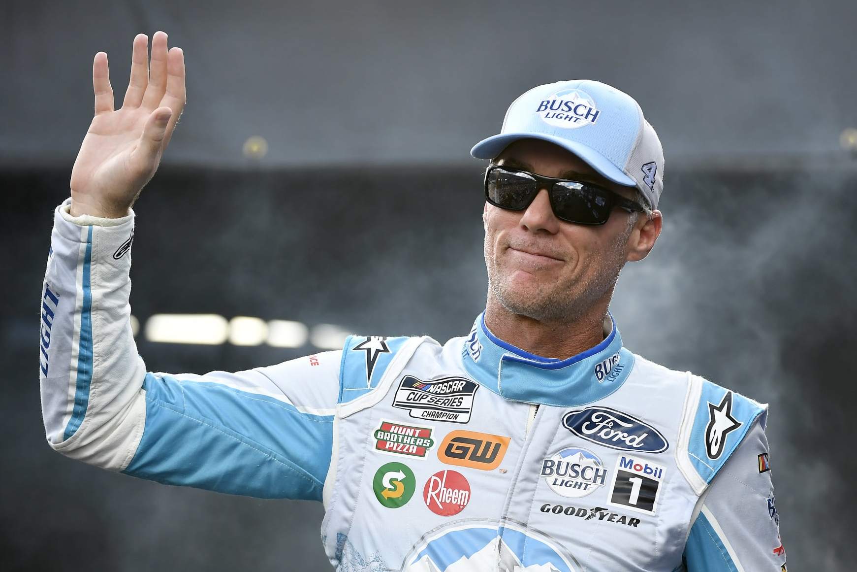 DARLINGTON, SOUTH CAROLINA - SEPTEMBER 04: Kevin Harvick, driver of the #4 Busch Light Retro Ford, waves to fans as he walks onstage during driver intros prior to the NASCAR Cup Series Cook Out Southern 500 at Darlington Raceway on September 04, 2022 in Darlington, South Carolina. (Photo by Logan Riely/Getty Images)