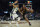 Cleveland Cavaliers' Evan Mobley (4) drives against Milwaukee Bucks' Giannis Antetokounmpo (34) in the second half of an NBA basketball game, Wednesday, Jan. 26, 2022, in Cleveland. (AP Photo/Tony Dejak)
