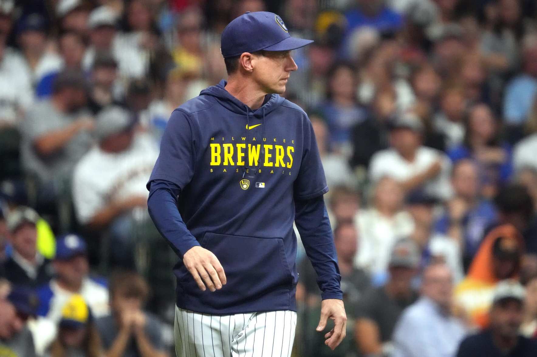 MILWAUKEE, WISCONSIN - SEPTEMBER 16: Craig Counsell #30 of the Milwaukee Brewers walks onto the field to talk with an umpire during the fourth inning against the Washington Nationals at American Family Field on September 16, 2023 in Milwaukee, Wisconsin. (Photo by Kayla Wolf/Getty Images)