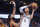 San Antonio center Victor Wembanyama (1) prepares to shoot against Oklahoma City forward Kenrich Williams, middle, as Oklahoma City forward Jalen Williams, left, looks on during the first half of an NBA in-season tournament basketball game Tuesday, Nov. 14, 2023, in Oklahoma City. (AP Photo/Nate Billings)