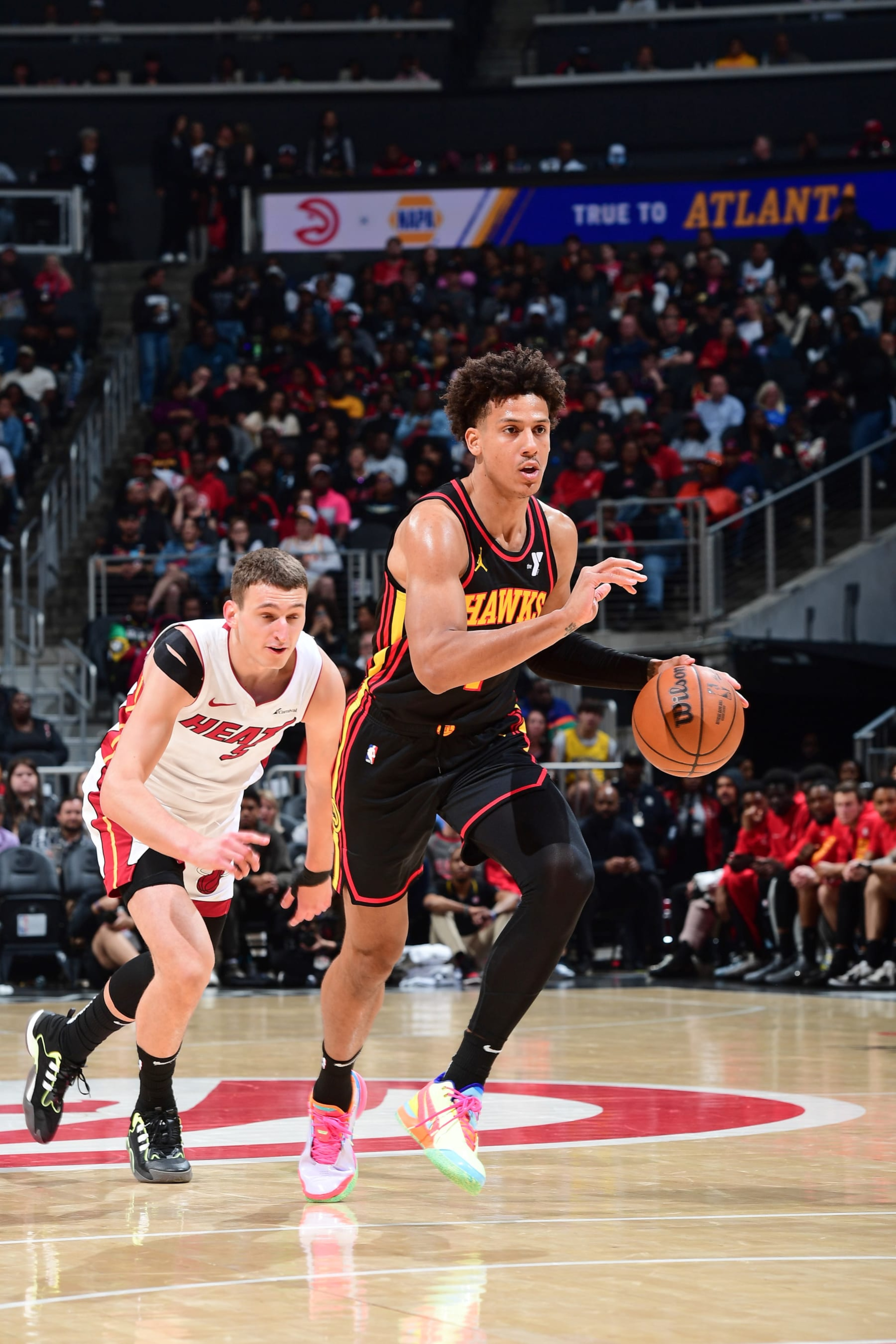 ATLANTA, GA - APRIL 9: Jalen Johnson #1 of the Atlanta Hawks dribbles the ball during the game against the Miami Heat on April 9, 2024 at State Farm Arena in Atlanta, Georgia.  NOTE TO USER: User expressly acknowledges and agrees that, by downloading and/or using this Photograph, user is consenting to the terms and conditions of the Getty Images License Agreement. Mandatory Copyright Notice: Copyright 2024 NBAE (Photo by Scott Cunningham/NBAE via Getty Images)