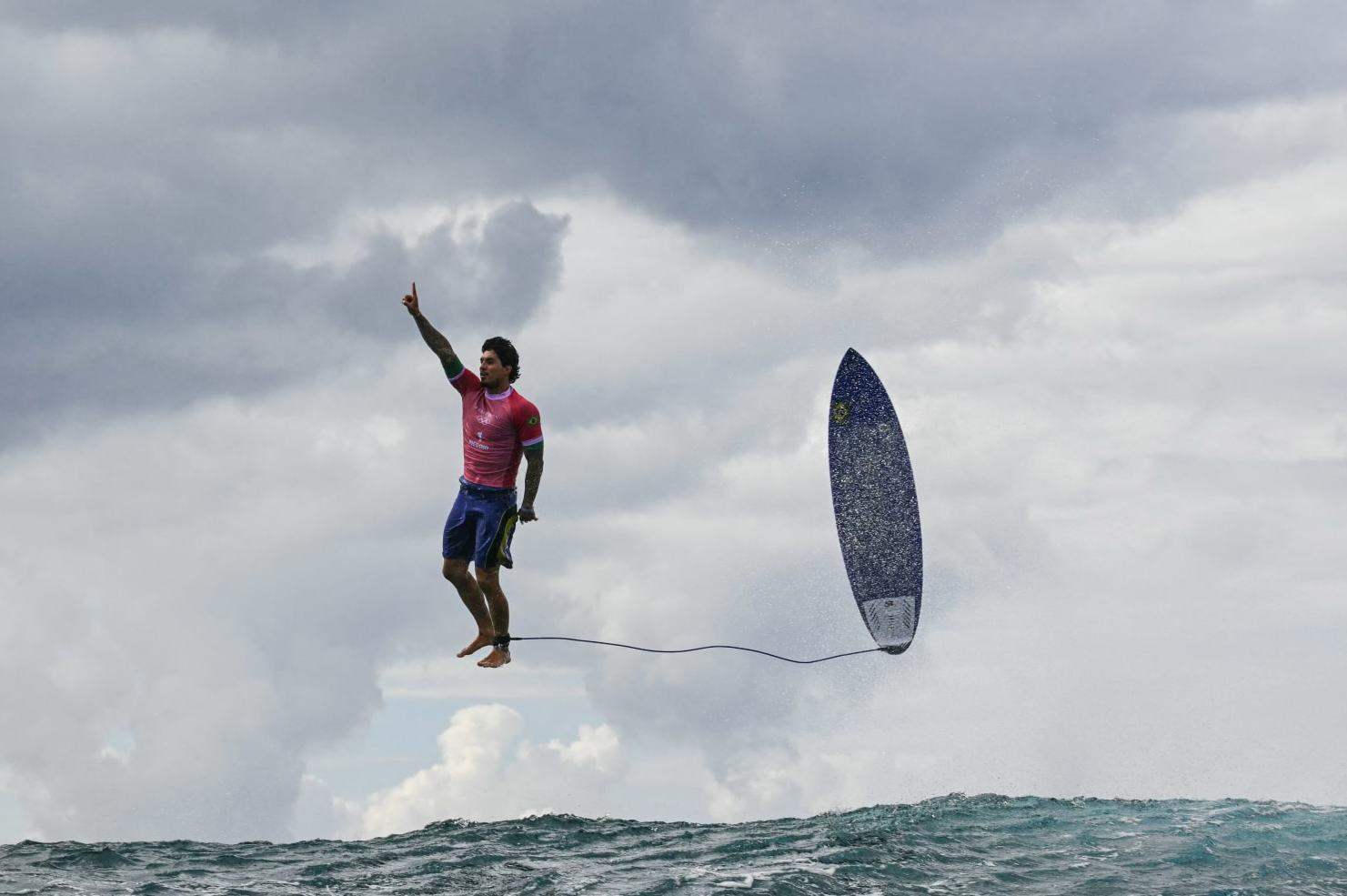 TOPSHOT - Brazil's Gabriel Medina reacts after getting a large wave in the 5th heat of the men's surfing round 3, during the Paris 2024 Olympic Games, in Teahupo'o, on the French Polynesian Island of Tahiti, on July 29, 2024. (Photo by Jerome BROUILLET / AFP) (Photo by JEROME BROUILLET/AFP via Getty Images)