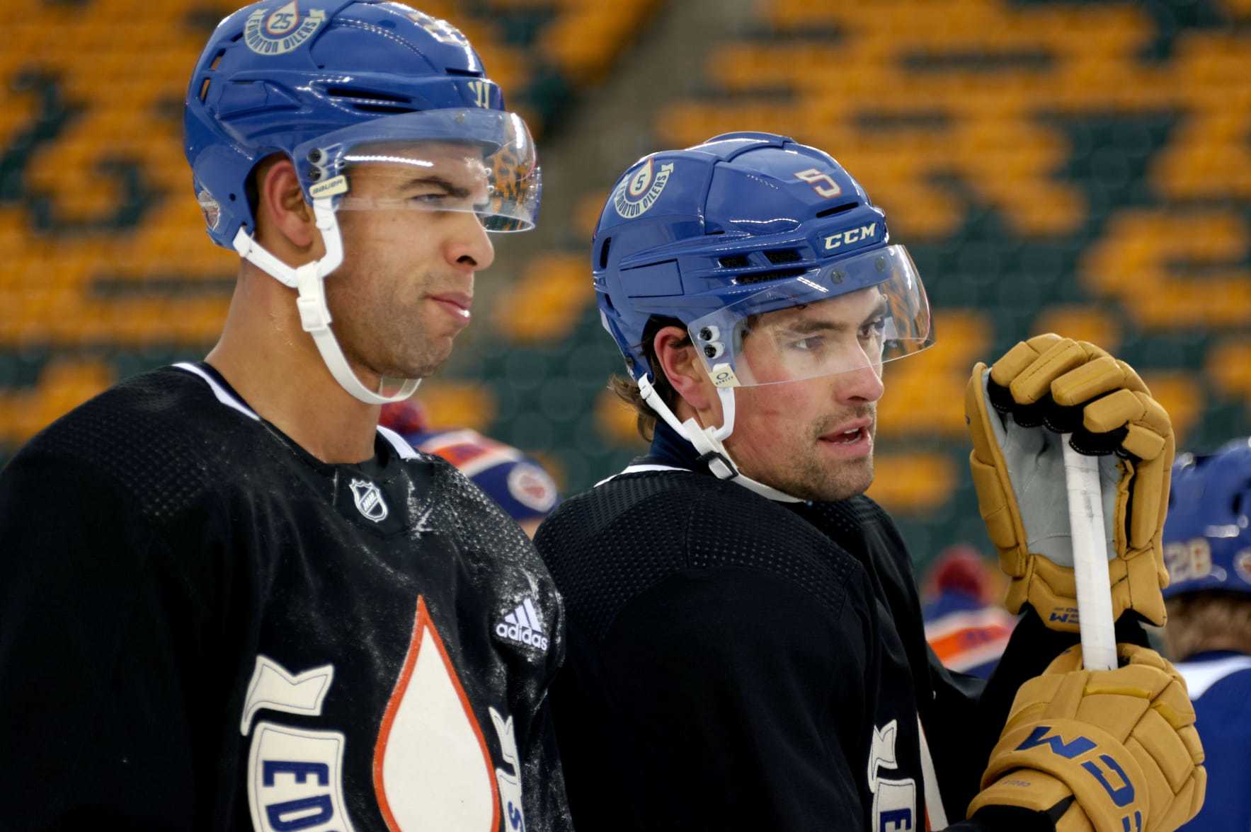 EDMONTON, ALBERTA - OCTOBER 28: (L-R) Darnell Nurse #25 and Cody Ceci #5 of the Edmonton Oilers look on during practice at Commonwealth Stadium on October 28, 2023 in Edmonton, Alberta. (Photo by Dave Sandford/NHLI via Getty Images)