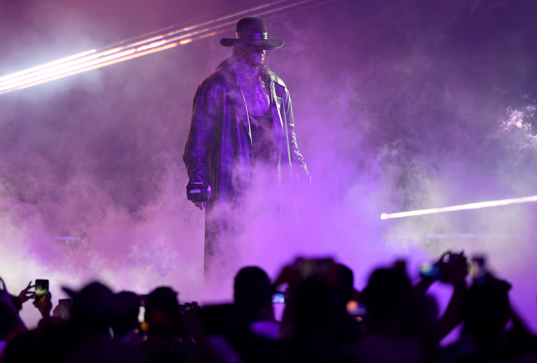 TOPSHOT - World Wrestling Entertainment star The Undertaker makes his way to the ring during a match at the World Wrestling Entertainment (WWE) Super Showdown event in the Saudi Red Sea port city of Jeddah late on January 7, 2019. (Photo by Amer HILABI / AFP) (Photo credit should read AMER HILABI/AFP via Getty Images)