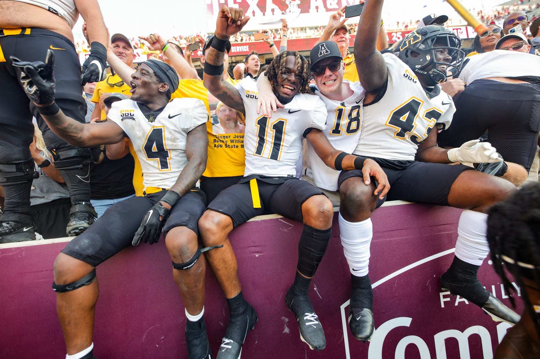 COLLEGE STATION, TEXAS - SEPTEMBER 10: Jordan Favors #11, Hansky Paillant #43, and Daetrich Harrington #4 of the Appalachian State Mountaineers celebrate defeating the Texas A&M Aggies at Kyle Field on September 10, 2022 in College Station, Texas. (Photo by Carmen Mandato/Getty Images)