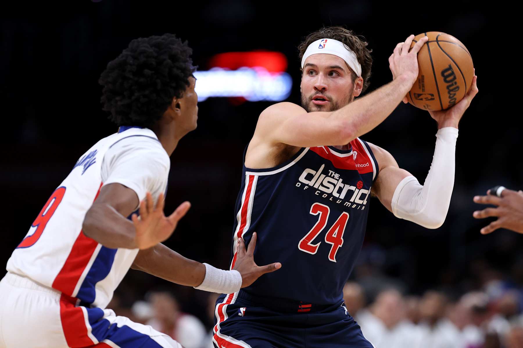 WASHINGTON, DC - JANUARY 15: Corey Kispert #24 of the Washington Wizards is guarded by Ausar Thompson #9 of the Detroit Pistons during the first half at Capital One Arena on January 15, 2024 in Washington, DC. NOTE TO USER: User expressly acknowledges and agrees that, by downloading and or using this photograph, User is consenting to the terms and conditions of the Getty Images License Agreement  (Photo by Patrick Smith/Getty Images)