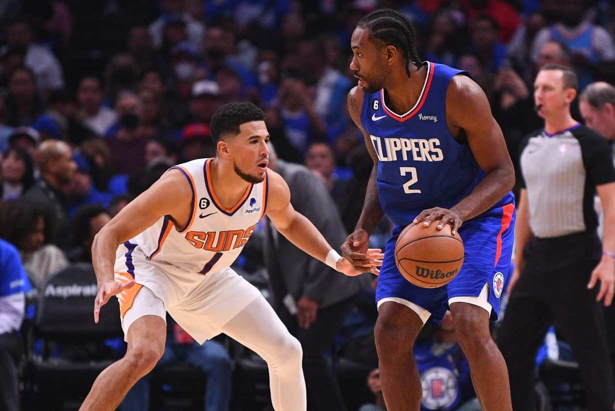 LOS ANGELES, CA - OCTOBER 23: Los Angeles Clippers forward Kawhi Leonard (2) guarded by Phoenix Suns guard Devin Booker (1) during a NBA game between the Phoenix Suns and the Los Angeles Clippers on October 23, 2022 at Crypto.com Arena in Los Angeles, CA. (Photo by Brian Rothmuller/Icon Sportswire via Getty Images) LOS ANGELES, CA - OCTOBER 23: Los Angeles Clippers forward Kawhi Leonard (2) guarded by Phoenix Suns guard Devin Booker (1) during a NBA game between the Phoenix Suns and the Los Angeles Clippers on October 23, 2022 at Crypto.com Arena in Los Angeles, CA. (Photo by Brian Rothmuller/Icon Sportswire via Getty Images)