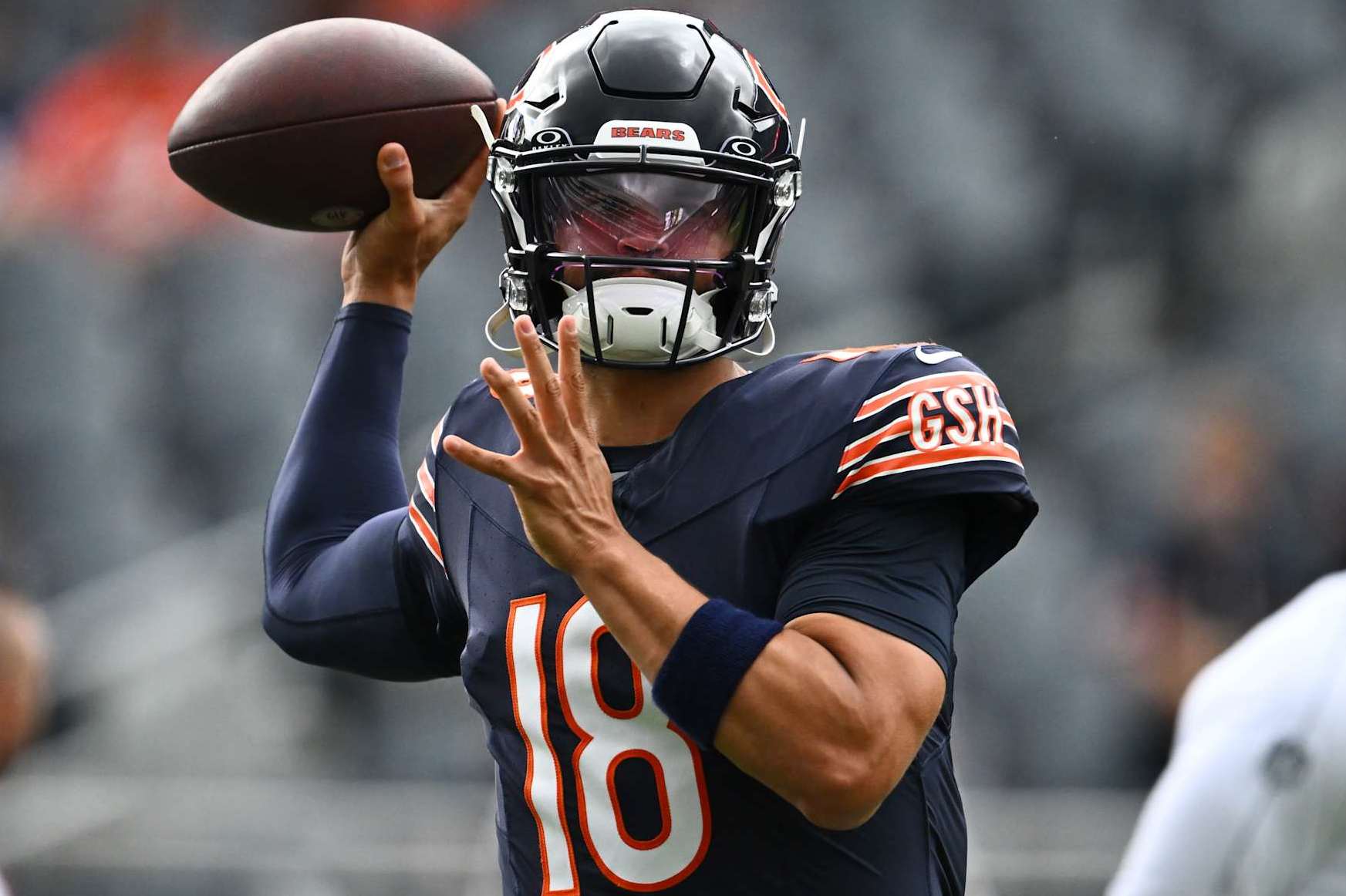 CHICAGO, ILLINOIS - AUGUST 17: Caleb Williams #18 of the Chicago Bears warms up before a preseason game against the Cincinnati Bengals at Soldier Field on August 17, 2024 in Chicago, Illinois. (Photo by Quinn Harris/Getty Images)