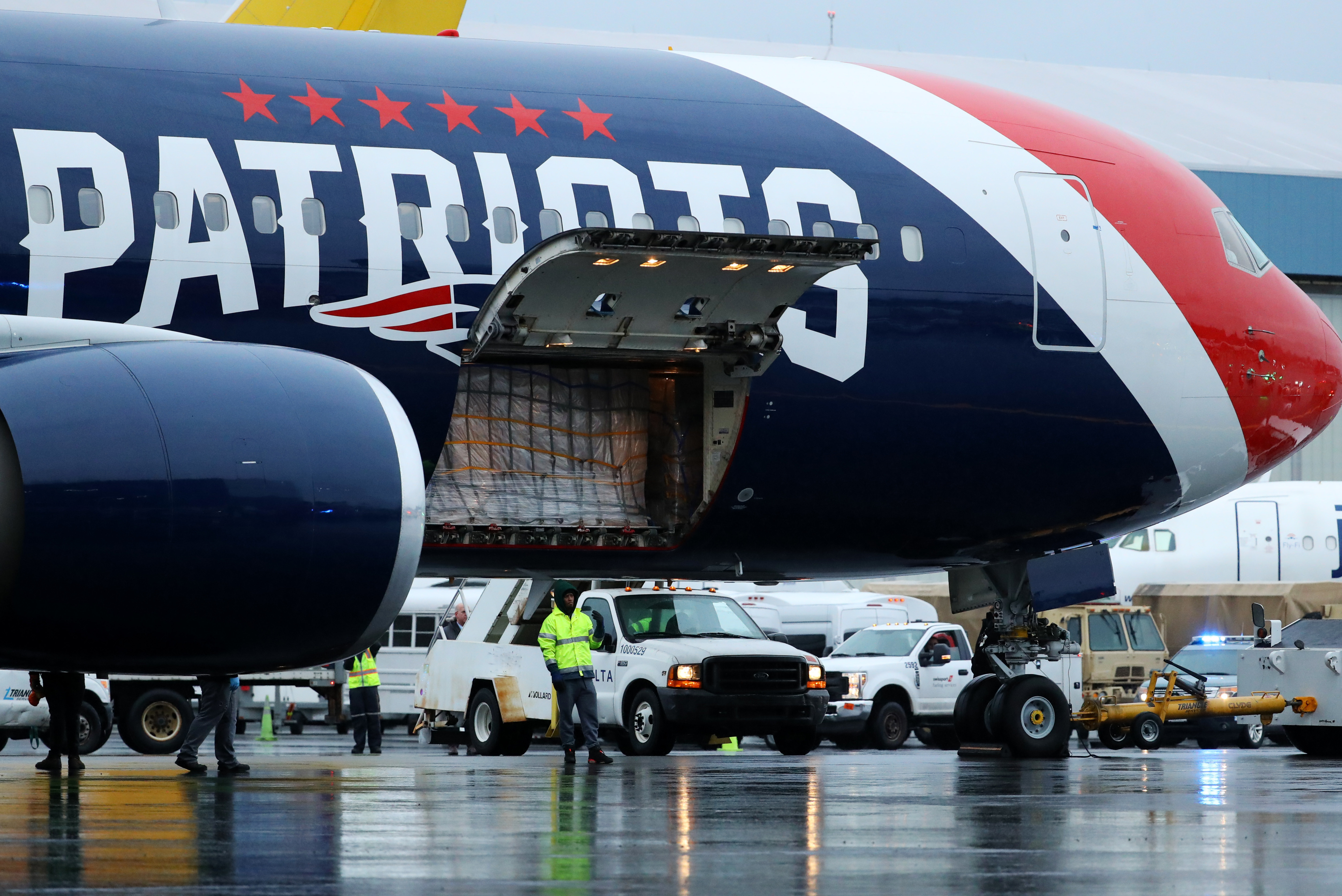 Patriots use team plane to help Mass., fly N95 in from China - The