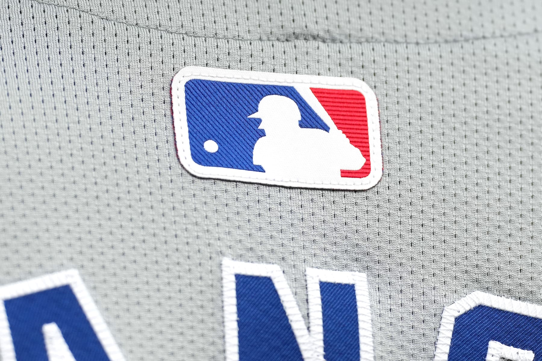 CINCINNATI, OHIO - JULY 29: Detail look at a MLB logo on the back of a Chicago Cubs jersey before the game against the Cincinnati Reds at Great American Ball Park on July 29, 2024 in Cincinnati, Ohio. (Photo by Jason Mowry/Getty Images)