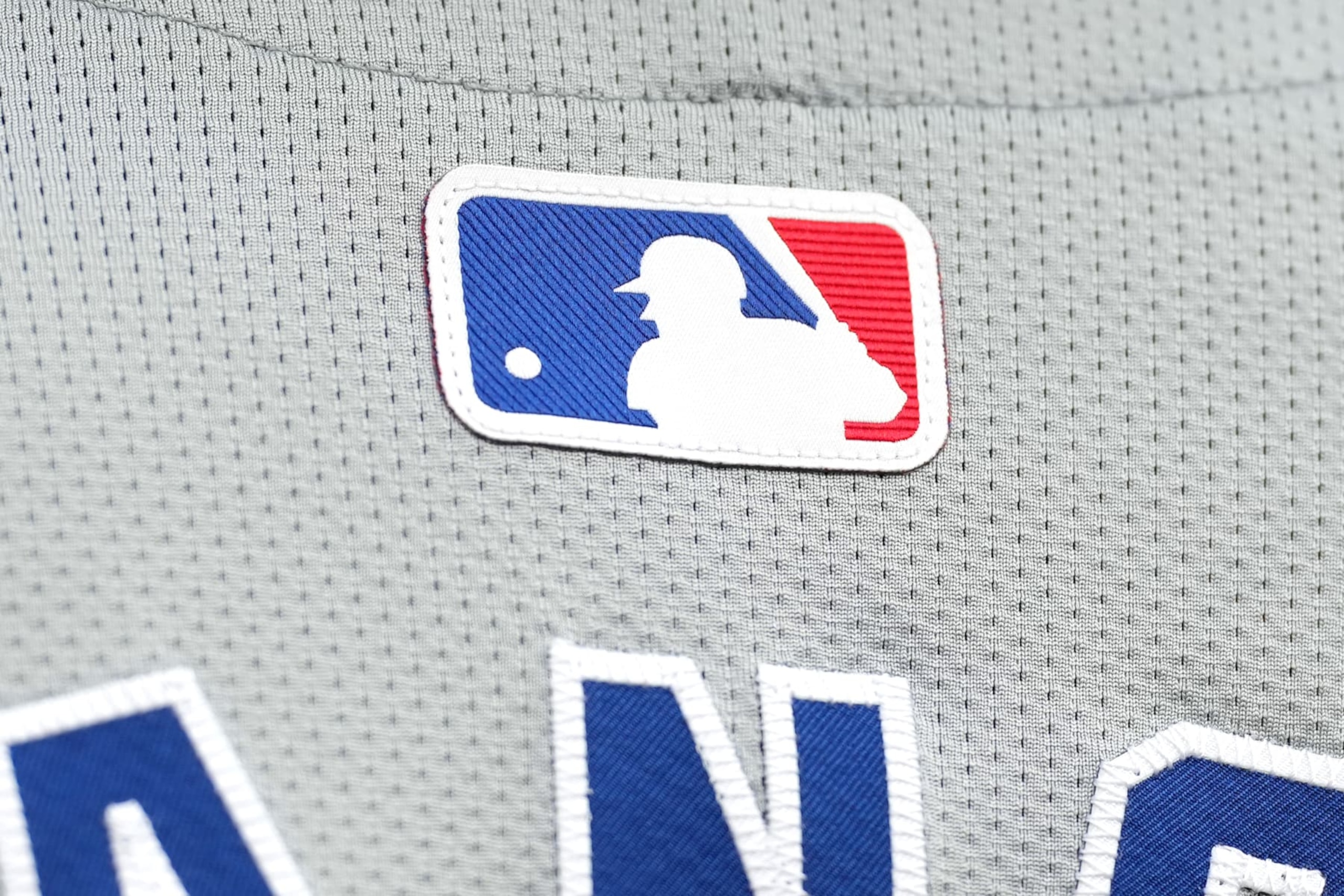 CINCINNATI, OHIO - JULY 29: Detail look at a MLB logo on the back of a Chicago Cubs jersey before the game against the Cincinnati Reds at Great American Ball Park on July 29, 2024 in Cincinnati, Ohio. (Photo by Jason Mowry/Getty Images)