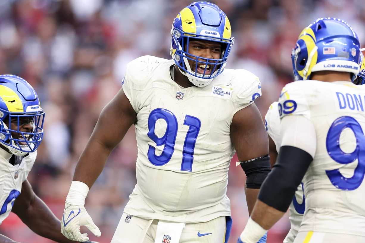 GLENDALE, ARIZONA - NOVEMBER 26: Kobie Turner #91 of the Los Angeles Rams celebrates after a sack during the second quarter against the Arizona Cardinals at State Farm Stadium on November 26, 2023 in Glendale, Arizona. (Photo by Christian Petersen/Getty Images)