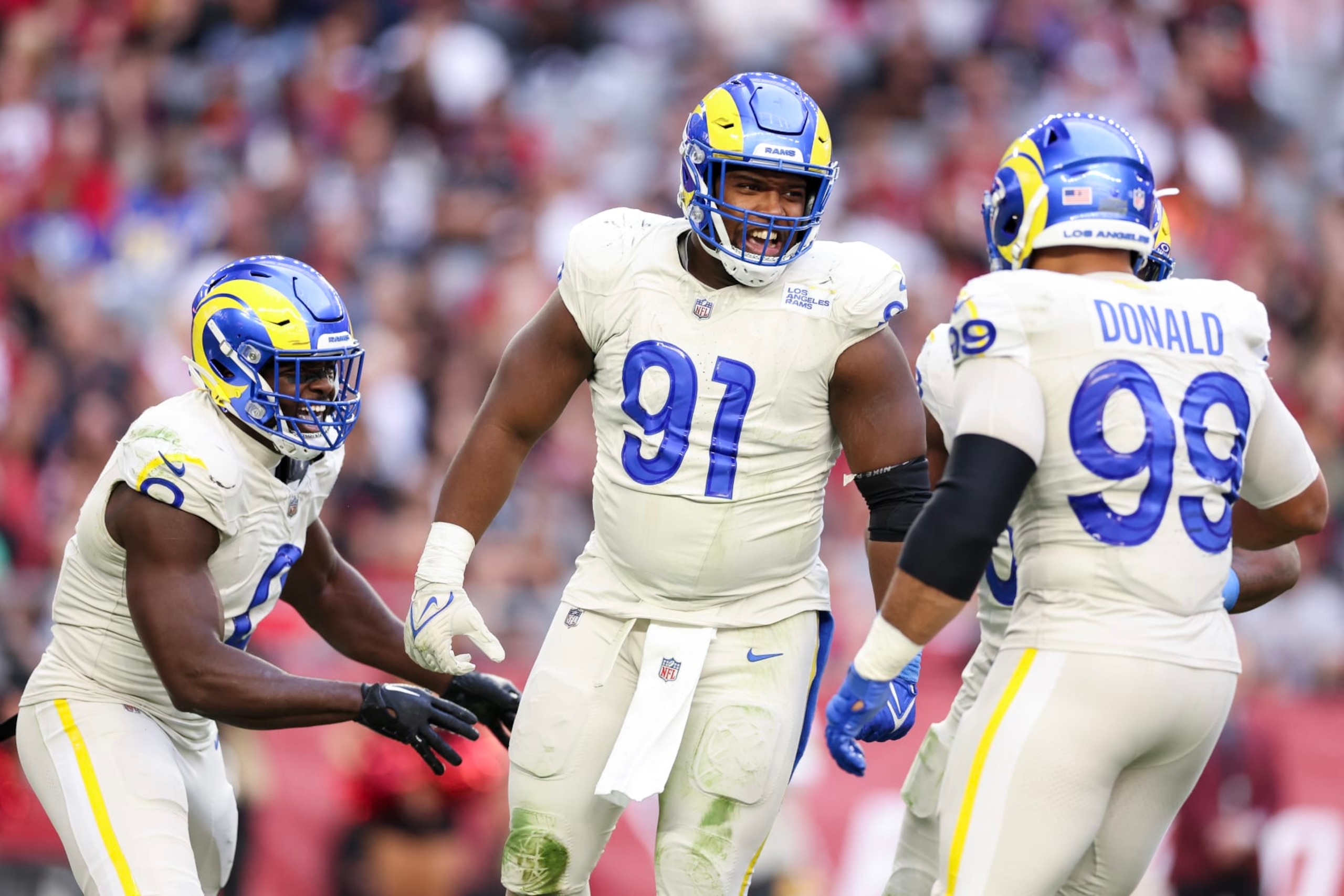 GLENDALE, ARIZONA - NOVEMBER 26: Kobie Turner #91 of the Los Angeles Rams celebrates after a sack during the second quarter against the Arizona Cardinals at State Farm Stadium on November 26, 2023 in Glendale, Arizona. (Photo by Christian Petersen/Getty Images)