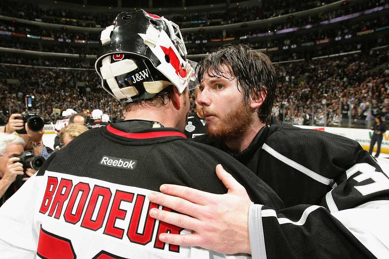 LOS ANGELES, CA - JUNE 11: Jonathan Quick #32 of the Los Angeles Kings is congratulated by Martin Brodeur #30 of the New Jersey Devils after the Kings won won Game Six of the 2012 Stanley Cup Final with the score of 6-1 at the Staples Center on June 11, 2012 in Los Angeles, California. (Photo by Dave Sandford/NHLI via Getty Images)