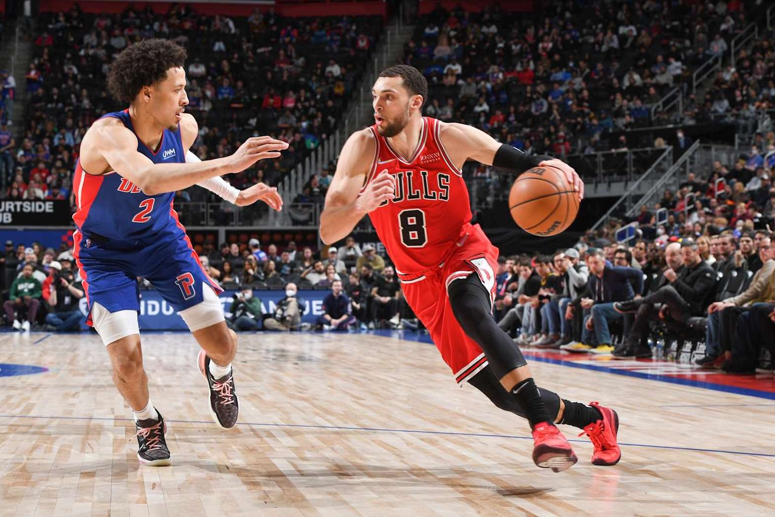 DETROIT, MI - MARCH 09: Zach LaVine #8 of the Chicago Bulls handles the ball during the game as Cade Cunningham #2 of the Detroit Pistons plays defense on March 09, 2022 at Little Caesars Arena in Detroit, Michigan. NOTE TO USER: User expressly acknowledges and agrees that, by downloading and/or using this photograph, User is consenting to the terms and conditions of the Getty Images License Agreement. Mandatory Copyright Notice: Copyright 2022 NBAE (Photo by Chris Schwegler/NBAE via Getty Images)
