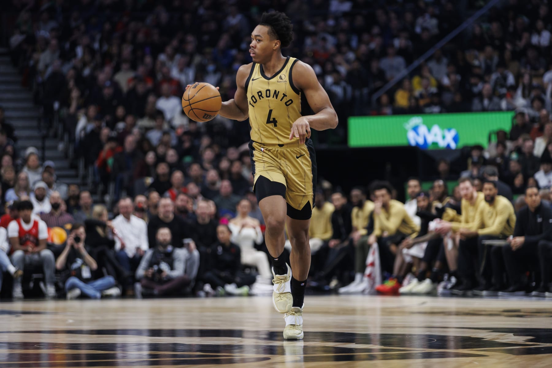 TORONTO, CANADA - MARCH 1: Scottie Barnes#4 of the Toronto Raptors dribbles during the first half of their NBA game against the Golden State Warriors at Scotiabank Arena on March 1, 2024 in Toronto, Canada. NOTE TO USER: User expressly acknowledges and agrees that, by downloading and or using this photograph, User is consenting to the terms and conditions of the Getty Images License Agreement. (Photo by Cole Burston/Getty Images)
