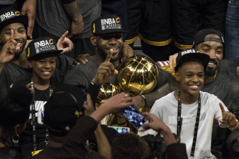 Basketball: NBA Finals: Cleveland Cavaliers LeBron James (23) victorious holding Larry O'Brien and MVP trophies after winning series vs Golden State Warriors at Oracle Arena. Game 7. Oakland, CA 6/19/2016 CREDIT: John W. McDonough (Photo by John W. McDonough /Sports Illustrated via Getty Images) (Set Number: SI146 TK1 )