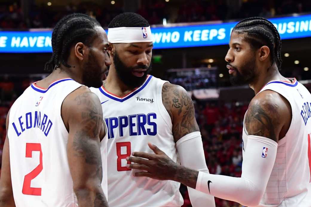 SALT LAKE CITY, UT - JUNE 8: Kawhi Leonard #2 and Marcus Morris Sr. #8 talk with Paul George #13 of the LA Clippers during Round 2, Game 1 of the 2021 NBA Playoffs on June 8, 2021 at vivint.SmartHome Arena in Salt Lake City, Utah. NOTE TO USER: User expressly acknowledges and agrees that, by downloading and or using this Photograph, User is consenting to the terms and conditions of the Getty Images License Agreement. Mandatory Copyright Notice: Copyright 2021 NBAE (Photo by Adam Pantozzi/NBAE via Getty Images) SALT LAKE CITY, UT - JUNE 8: Kawhi Leonard #2 and Marcus Morris Sr. #8 talk with Paul George #13 of the LA Clippers during Round 2, Game 1 of the 2021 NBA Playoffs on June 8, 2021 at vivint.SmartHome Arena in Salt Lake City, Utah. NOTE TO USER: User expressly acknowledges and agrees that, by downloading and or using this Photograph, User is consenting to the terms and conditions of the Getty Images License Agreement. Mandatory Copyright Notice: Copyright 2021 NBAE (Photo by Adam Pantozzi/NBAE via Getty Images)