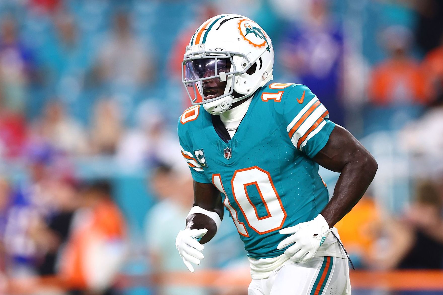 MIAMI GARDENS, FLORIDA - SEPTEMBER 12: Tyreek Hill #10 of the Miami Dolphins warms up prior to the game against the Buffalo Bills at Hard Rock Stadium on September 12, 2024 in Miami Gardens, Florida. (Photo by Megan Briggs/Getty Images)