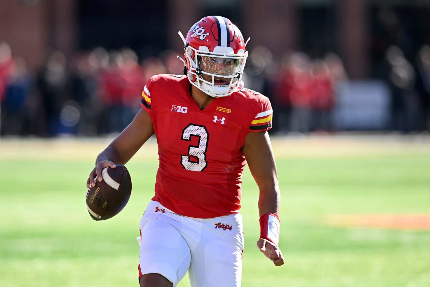 COLLEGE PARK, MARYLAND - NOVEMBER 18: Taulia Tagovailoa #3 of the Maryland Terrapins rolls out of the pocket against the Michigan Wolverines at SECU Stadium on November 18, 2023 in College Park, Maryland. (Photo by G Fiume/Getty Images)
