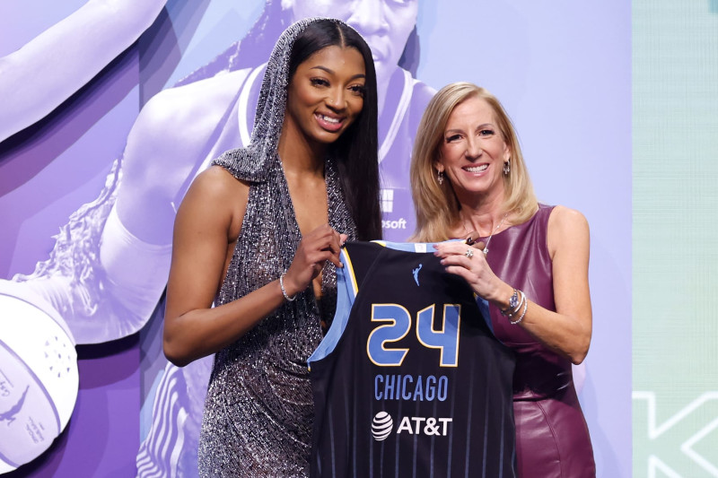 NEW YORK, NEW YORK - APRIL 15: Angel Reese poses with WNBA Commissioner Cathy Engelbert after being selected seventh overall pick by the Chicago Sky during the 2024 WNBA Draft at Brooklyn Academy of Music on April 15, 2024 in New York City. (Photo by Sarah Stier/Getty Images)