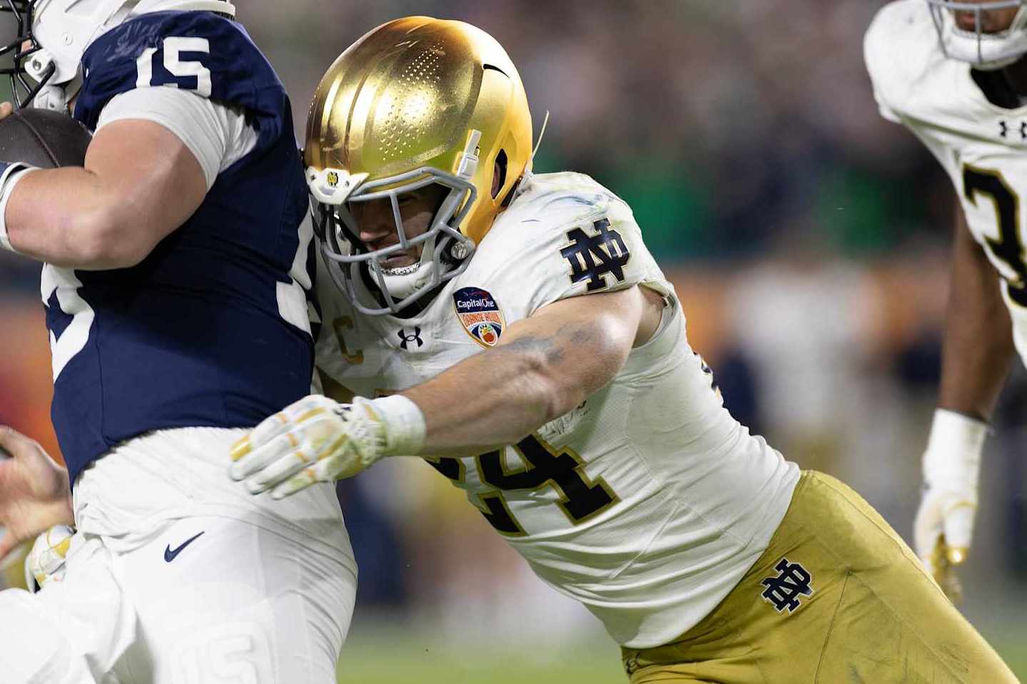MIAMI GARDENS, FLORIDA - JANUARY 9: Jack Kiser #24 of Notre Dame Fighting Irish sacks Drew Allar #15 of Penn State Nittany Lions during the game at Hard Rock Stadium on January 9, 2025 in Miami Gardens, Florida. (Photo by Michael Pimentel/ISI Photos/Getty Images)