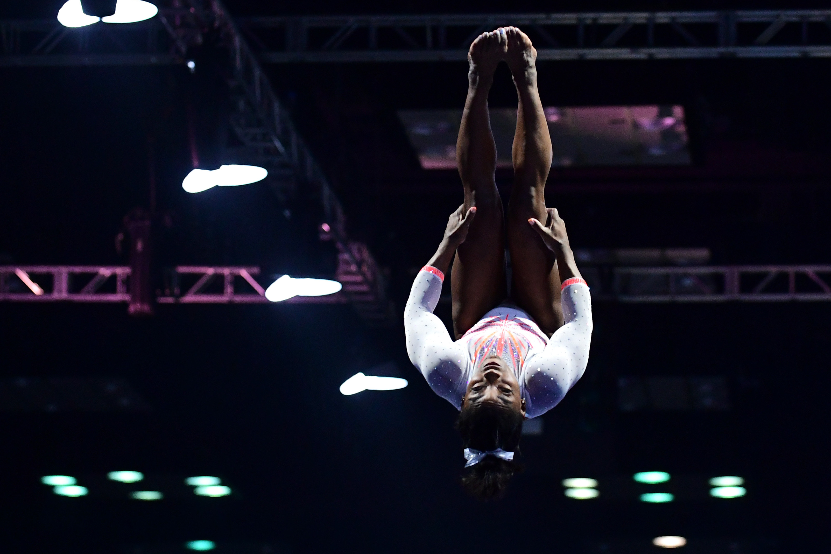 INDIANAPOLIS, INDIANA - MAY 22: Simone Biles lands the Yurchenko double pike while competing on the vault during the 2021 GK U.S. Classic gymnastics competition at the Indiana Convention Center on May 22, 2021 in Indianapolis, Indiana. Biles became the first woman in history to land the Yurchenko double pike in competition. (Photo by Emilee Chinn/Getty Images)