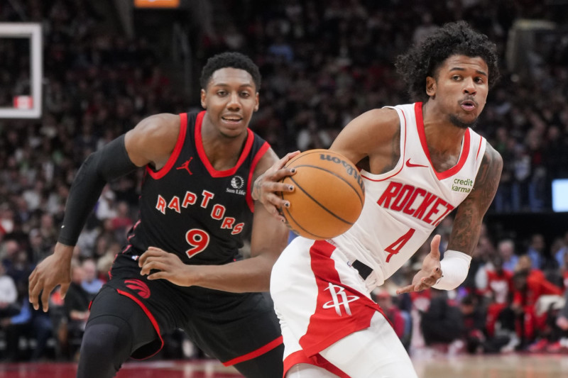 TORONTO, ON - FEBRUARY 9: Jalen Green #4 of the Houston Rockets dribbles against RJ Barrett #9 of the Toronto Raptors during the second half of their basketball game at the Scotiabank Arena on February 9, 2024 in Toronto, Ontario, Canada. NOTE TO USER: User expressly acknowledges and agrees that, by downloading and/or using this Photograph, user is consenting to the terms and conditions of the Getty Images License Agreement. (Photo by Mark Blinch/Getty Images)