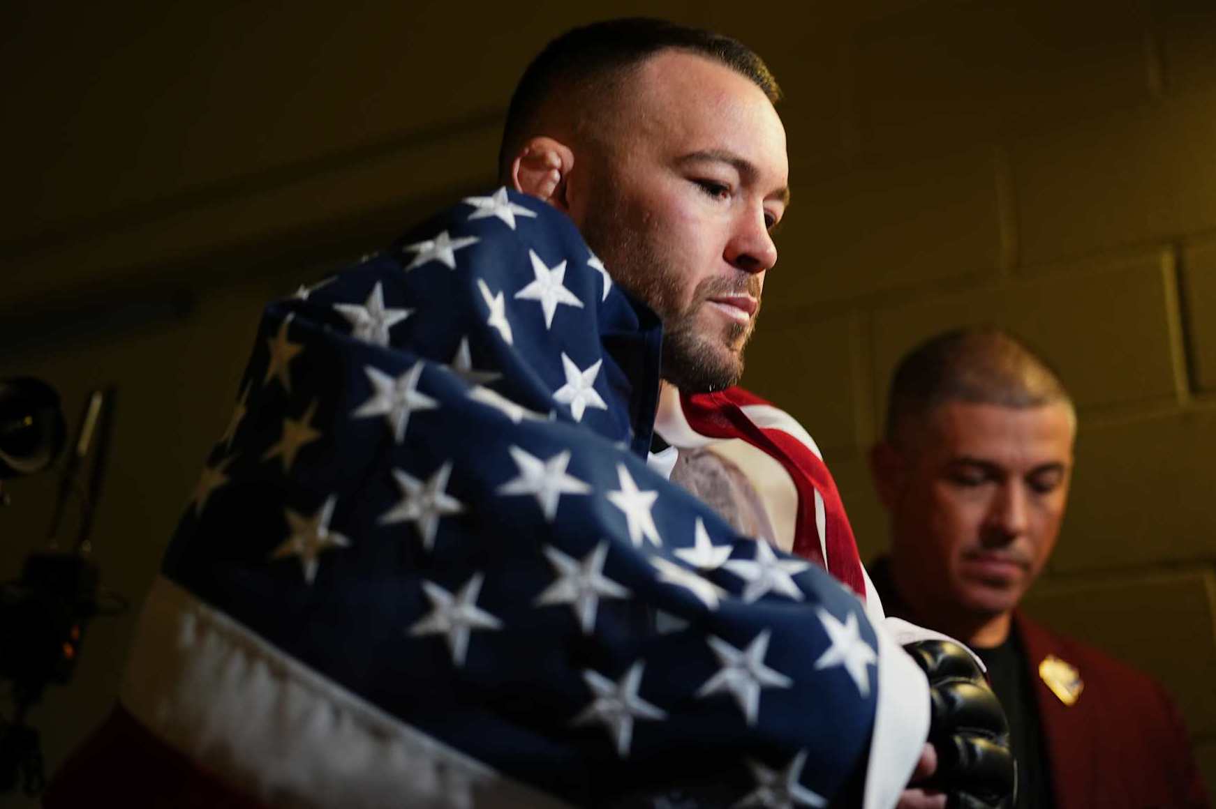 LAS VEGAS, NEVADA - DECEMBER 16: Colby Covington walks to the Octagon in the UFC welterweight championship fight during the UFC 296 event at T-Mobile Arena on December 16, 2023 in Las Vegas, Nevada. (Photo by Cooper Neill/Zuffa LLC via Getty Images)