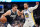 DALLAS, TX - MARCH 22: Luka Doncic #77 of the Dallas Mavericks dribbles the ball against Stephen Curry #30 of the Golden State Warriors on March 22, 2023 at the American Airlines Center in Dallas, Texas. NOTE TO USER: User expressly acknowledges and agrees that, by downloading and or using this photograph, User is consenting to the terms and conditions of the Getty Images License Agreement. Mandatory Copyright Notice: Copyright 2023 NBAE (Photo by Cooper Neill/NBAE via Getty Images)